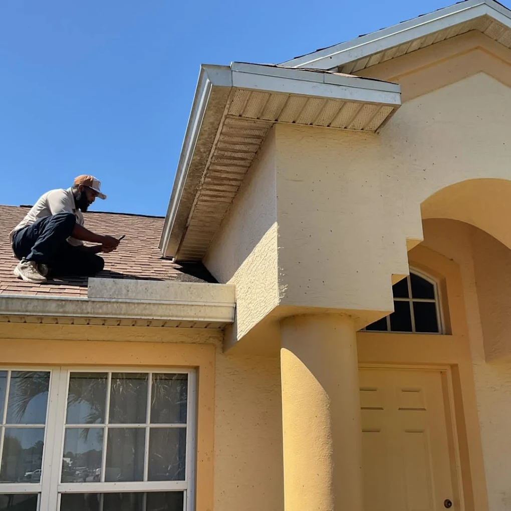 Issac of Swift Wildlife inspecting a Treasure Coast home